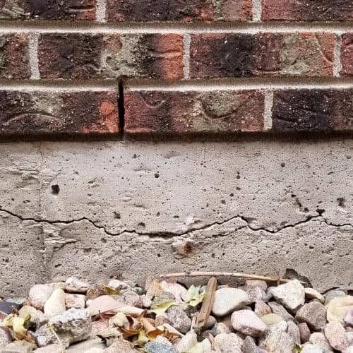 Cracked foundation wall requiring push pier stabilization