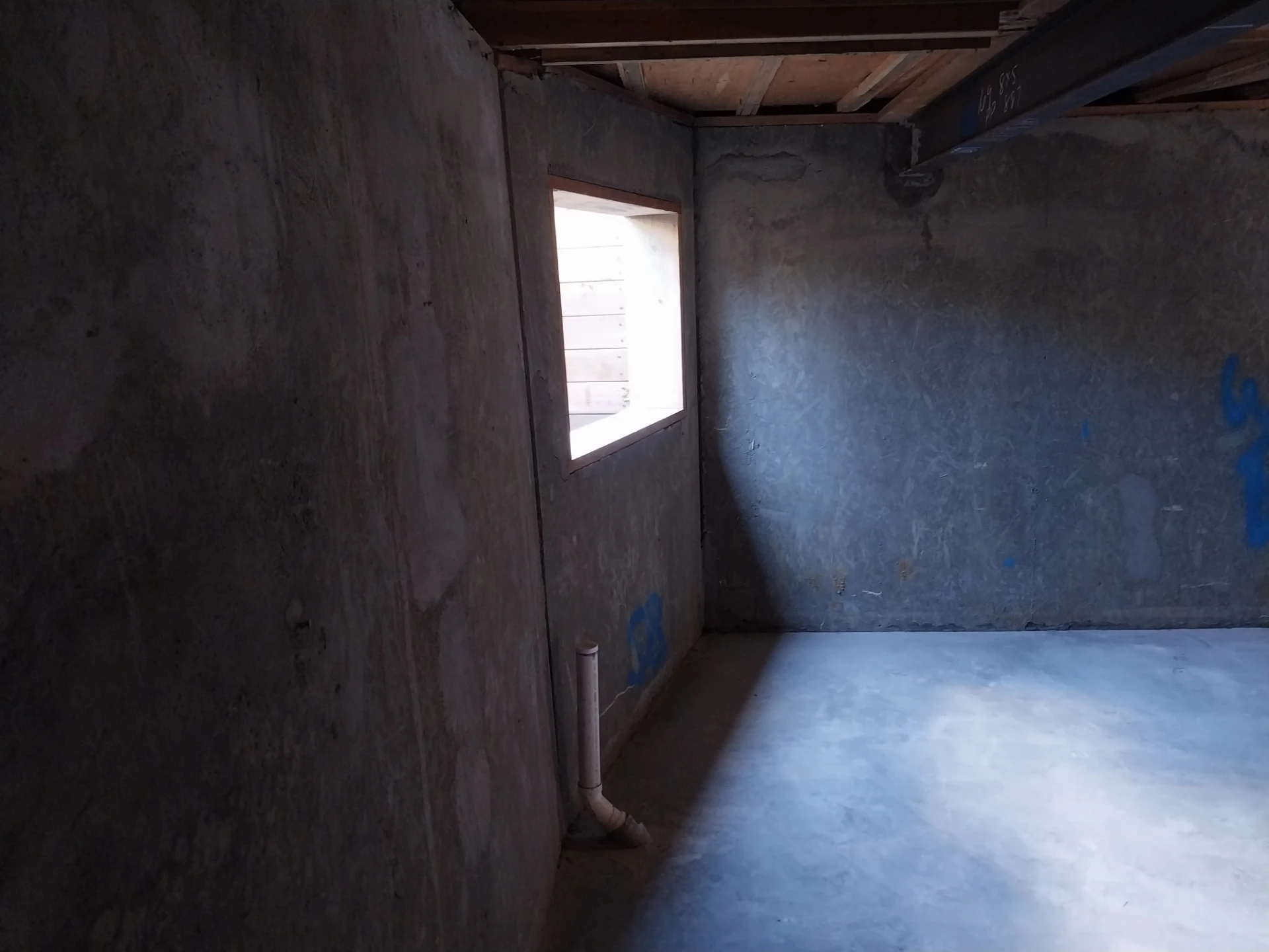 Finished basement structure with egress window after crawl space to basement remodel