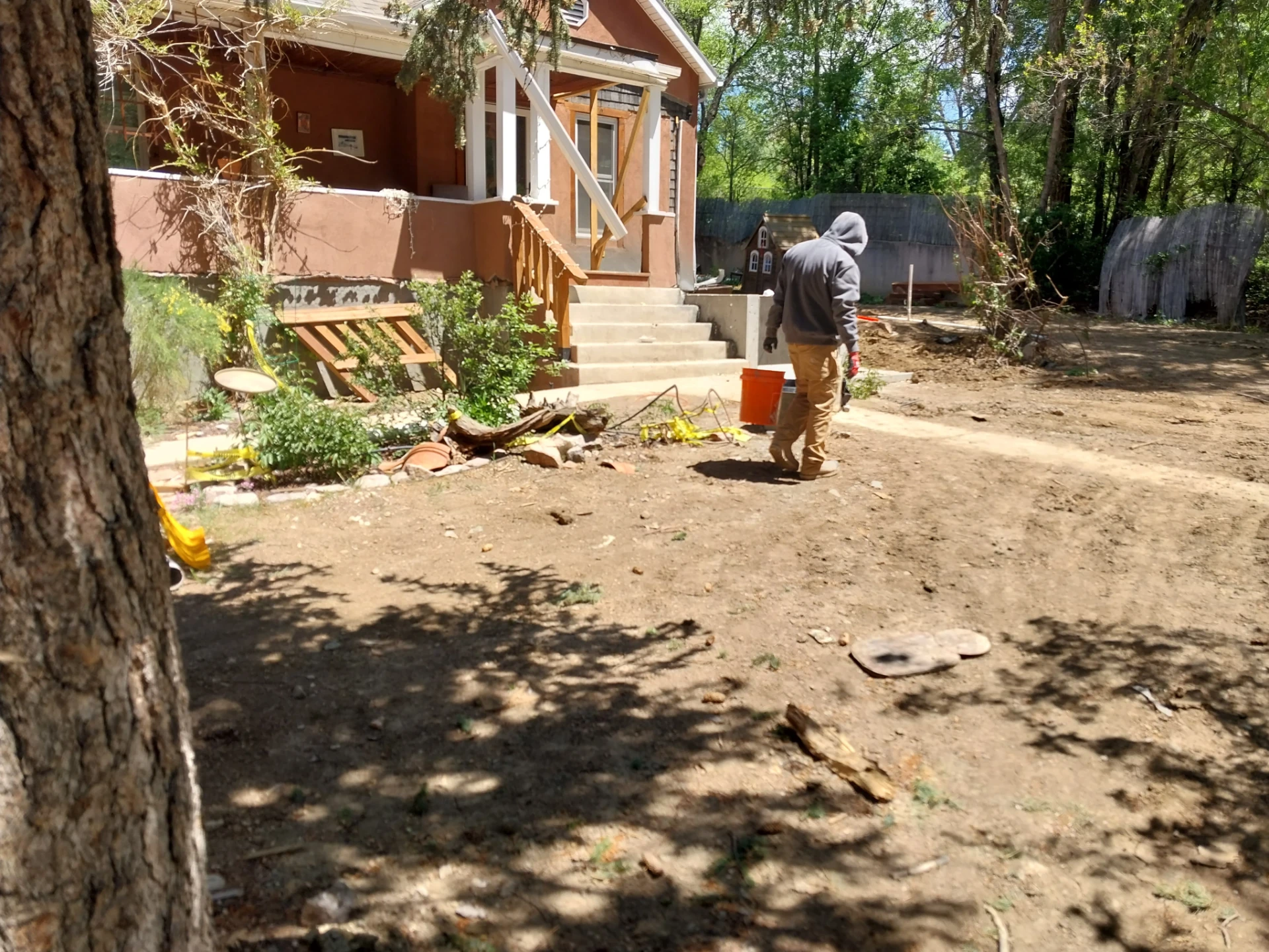 Restored home exterior with new basement access steps after crawl space conversion